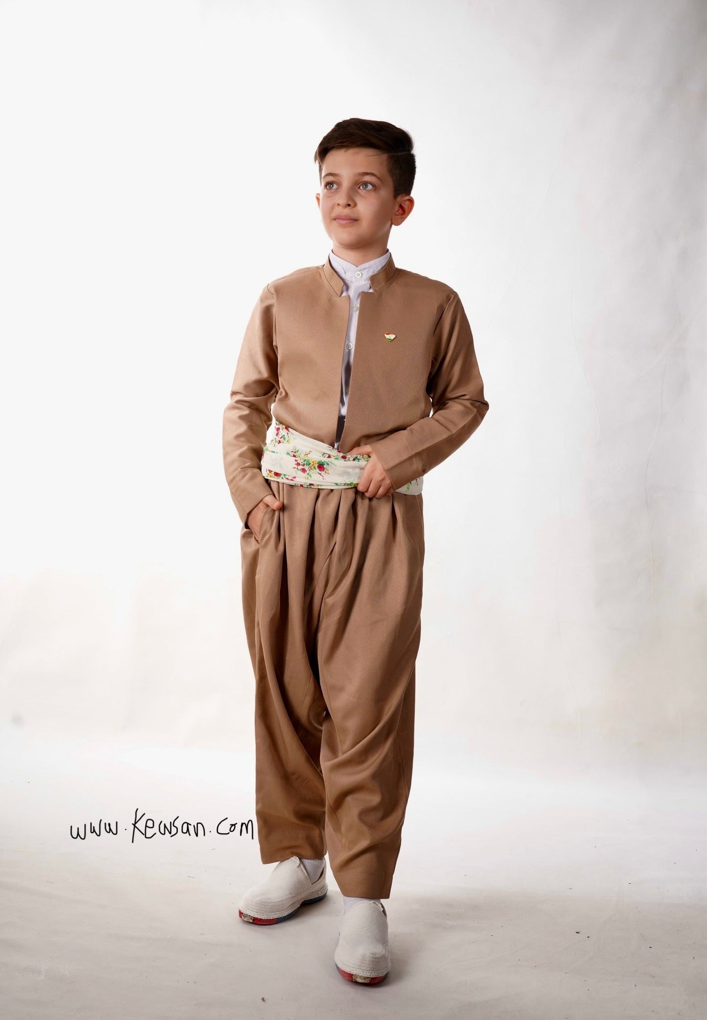 Elegant Kurdish dress for boys in deep cream, perfect for cultural celebrations and weddings.