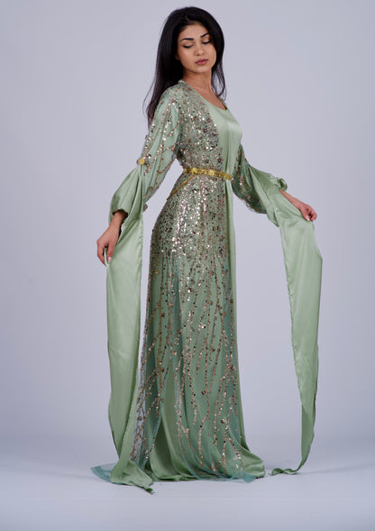 Elegant green Kurdish dress with gold embroidery, featuring crystals and sequins, perfect for weddings, Newroz, and cultural events.