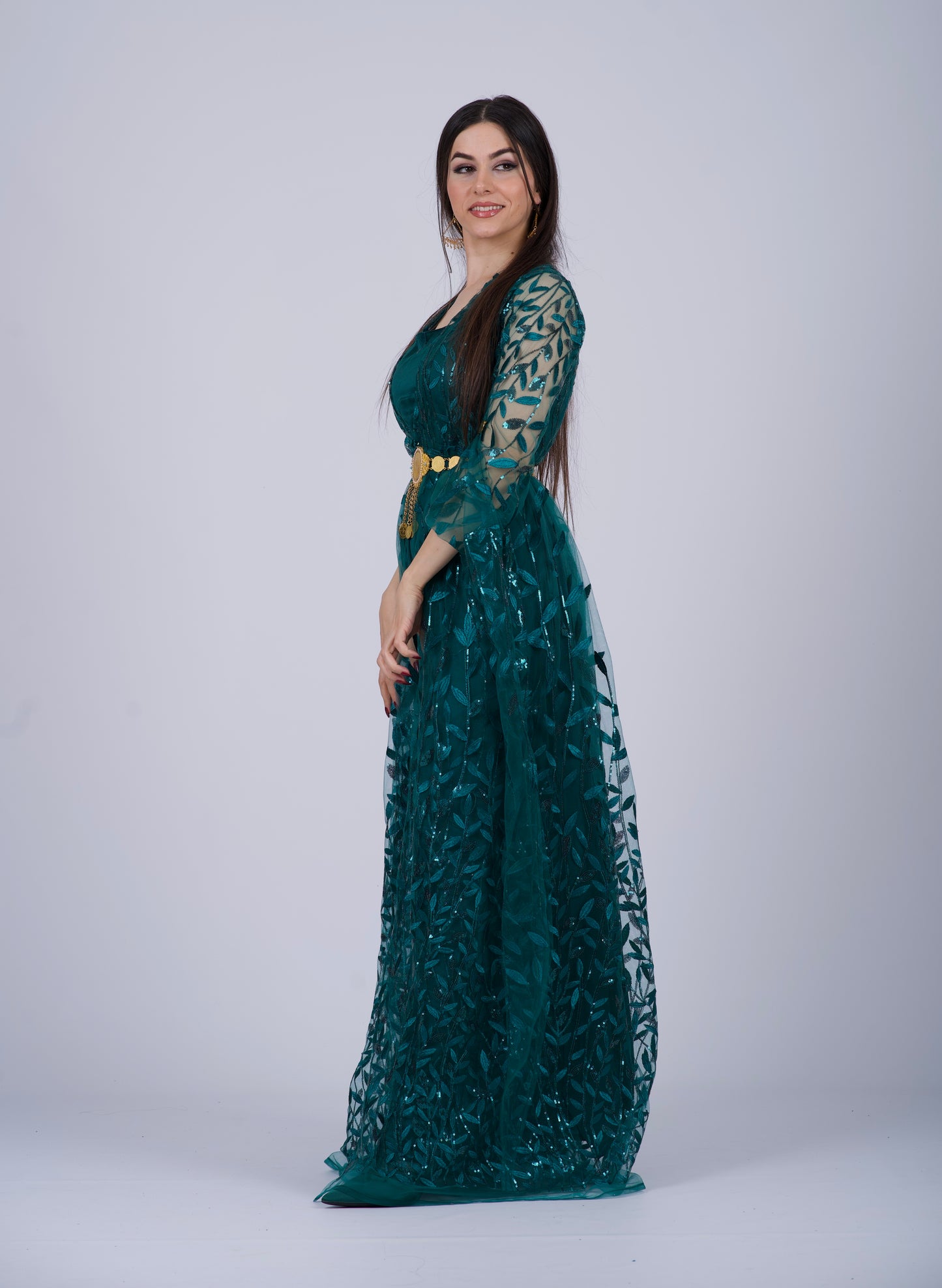 Green Badini-Style Kurdish Dress with long, flowing sleeves and intricate leaf-patterned embroidery, perfect for Newroz and weddings.