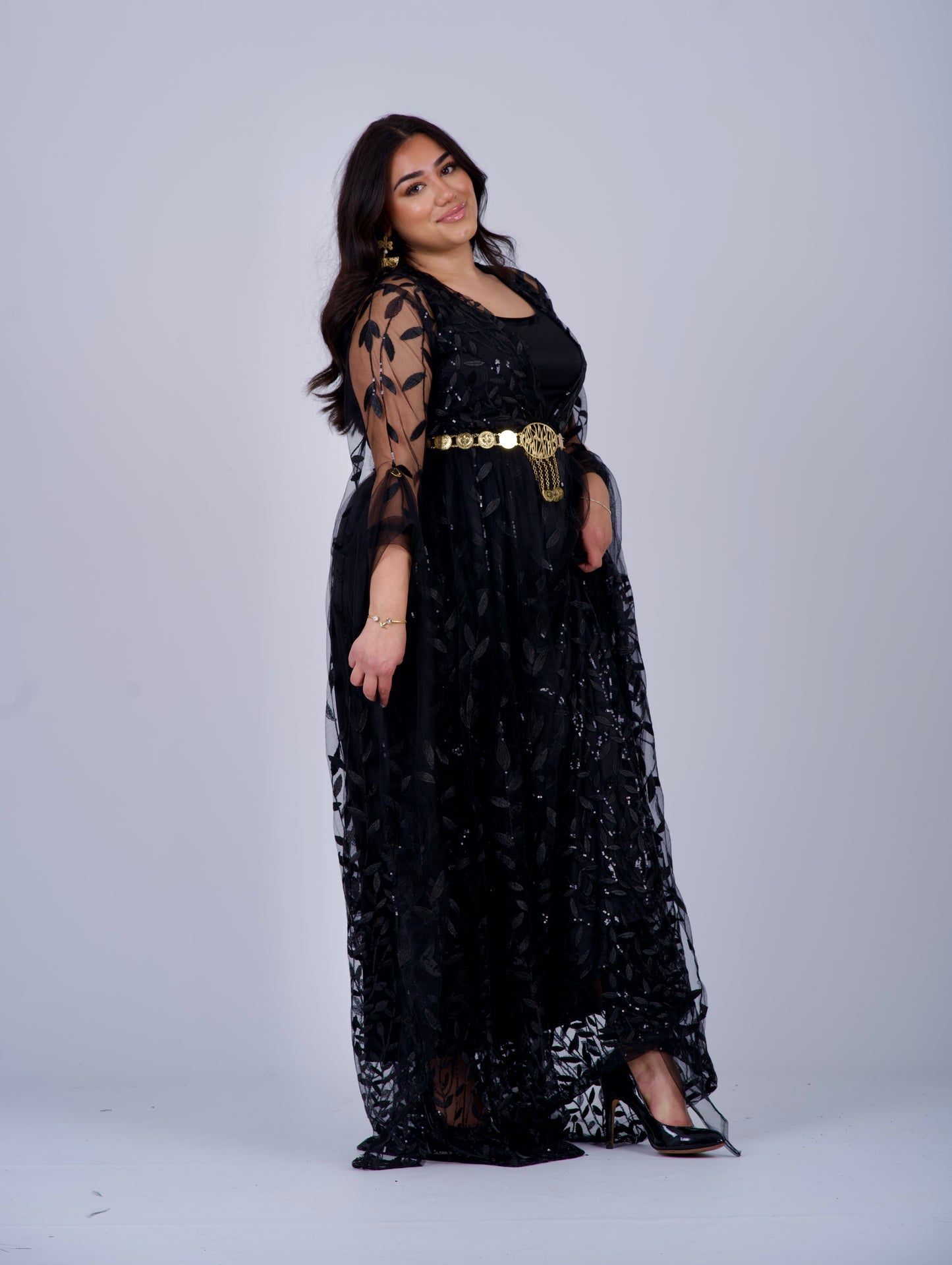 Black Badini-Style Kurdish Dress with elegant leaf-patterned embroidery, long flowing sleeves, and a flexible waist, perfect for Newroz and special cultural events.