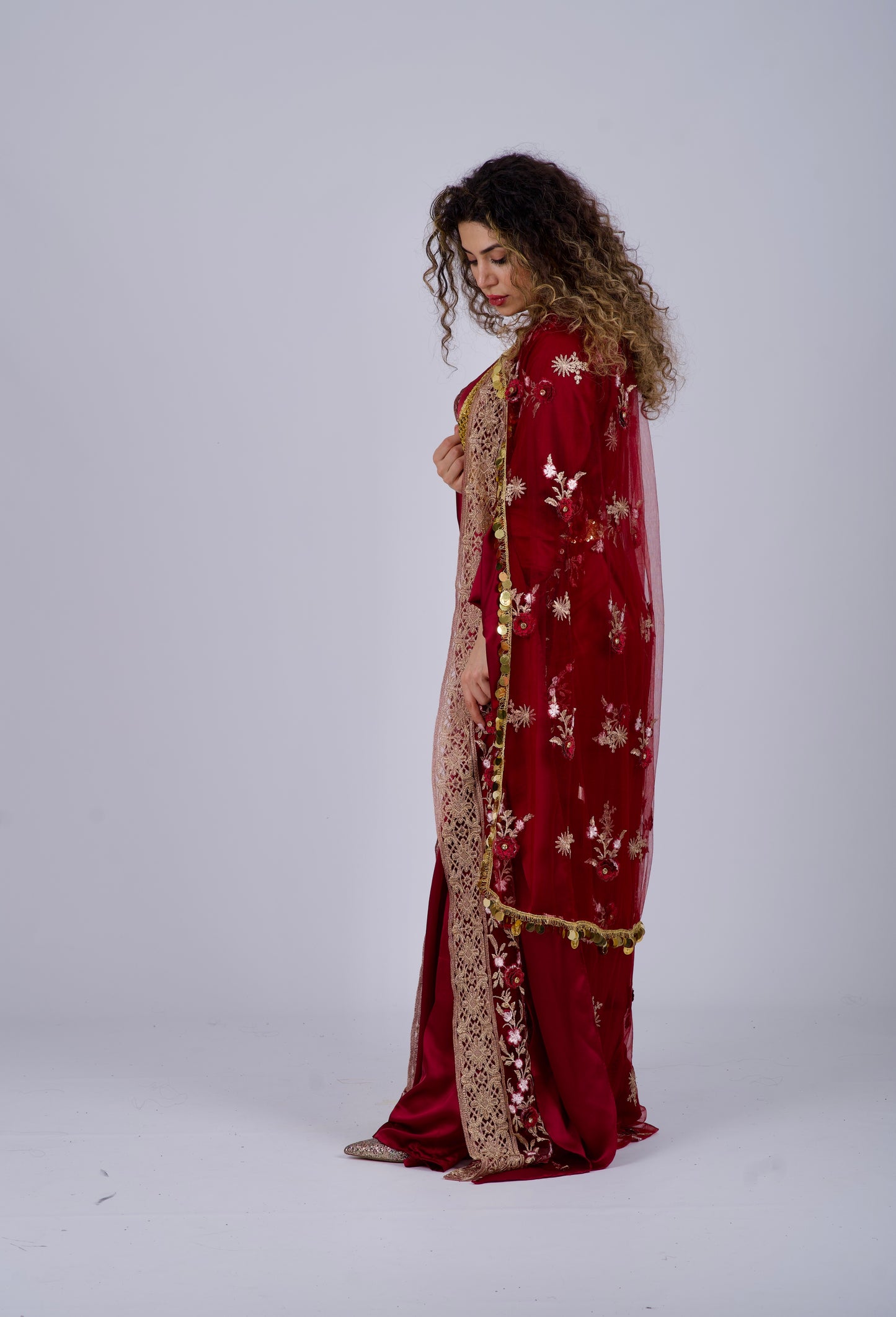 Handmade Kurdish dress in burgundy red wine with detailed embroidery and satin silk. Shipped worldwide, including Sweden, Germany, Denmark, and the USA.