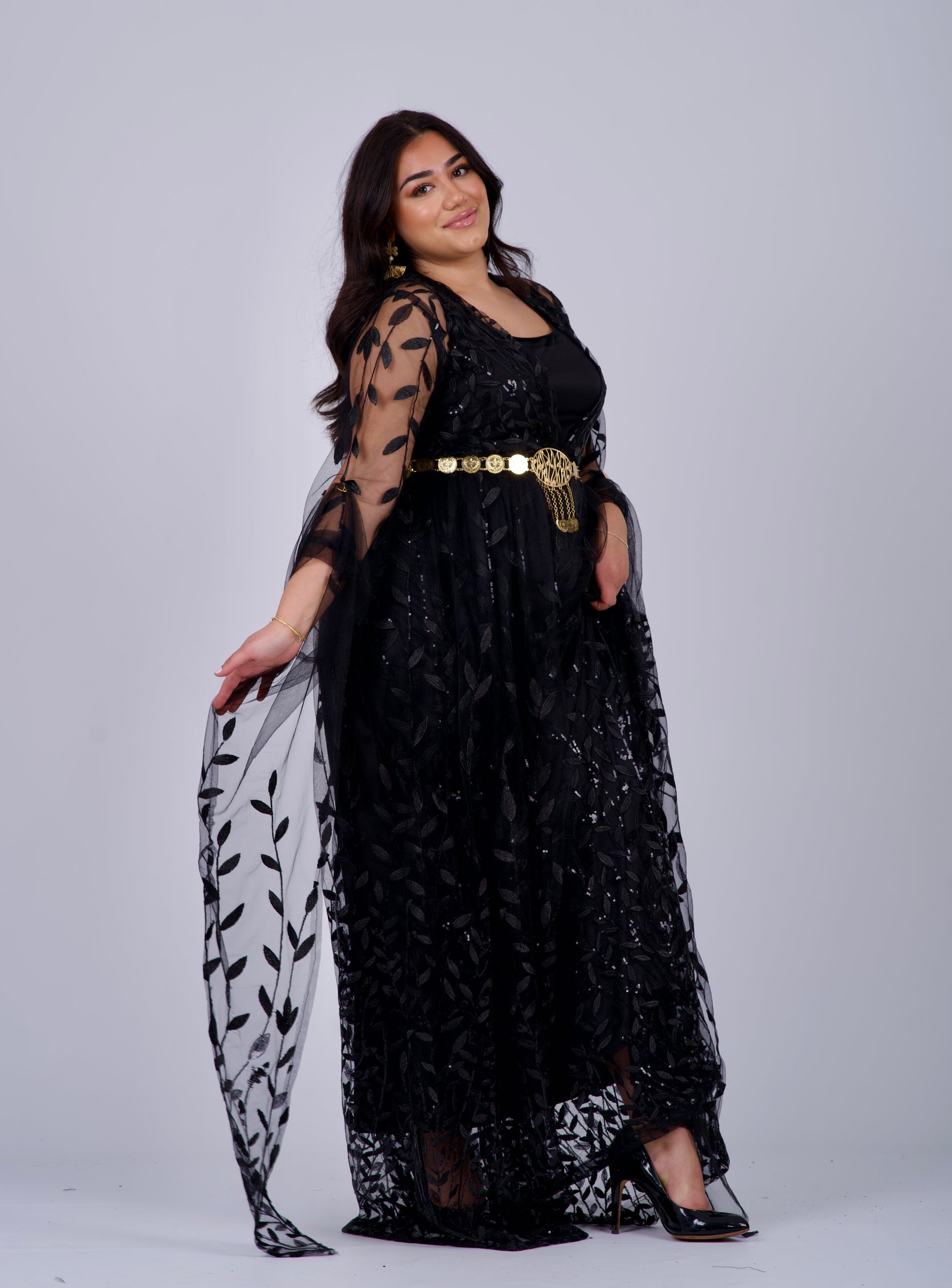 Classic black Kurdish dress featuring traditional Badini-style embroidery, adjustable waist, and flowing sleeves, ideal for weddings, festivals, and Newroz celebrations.