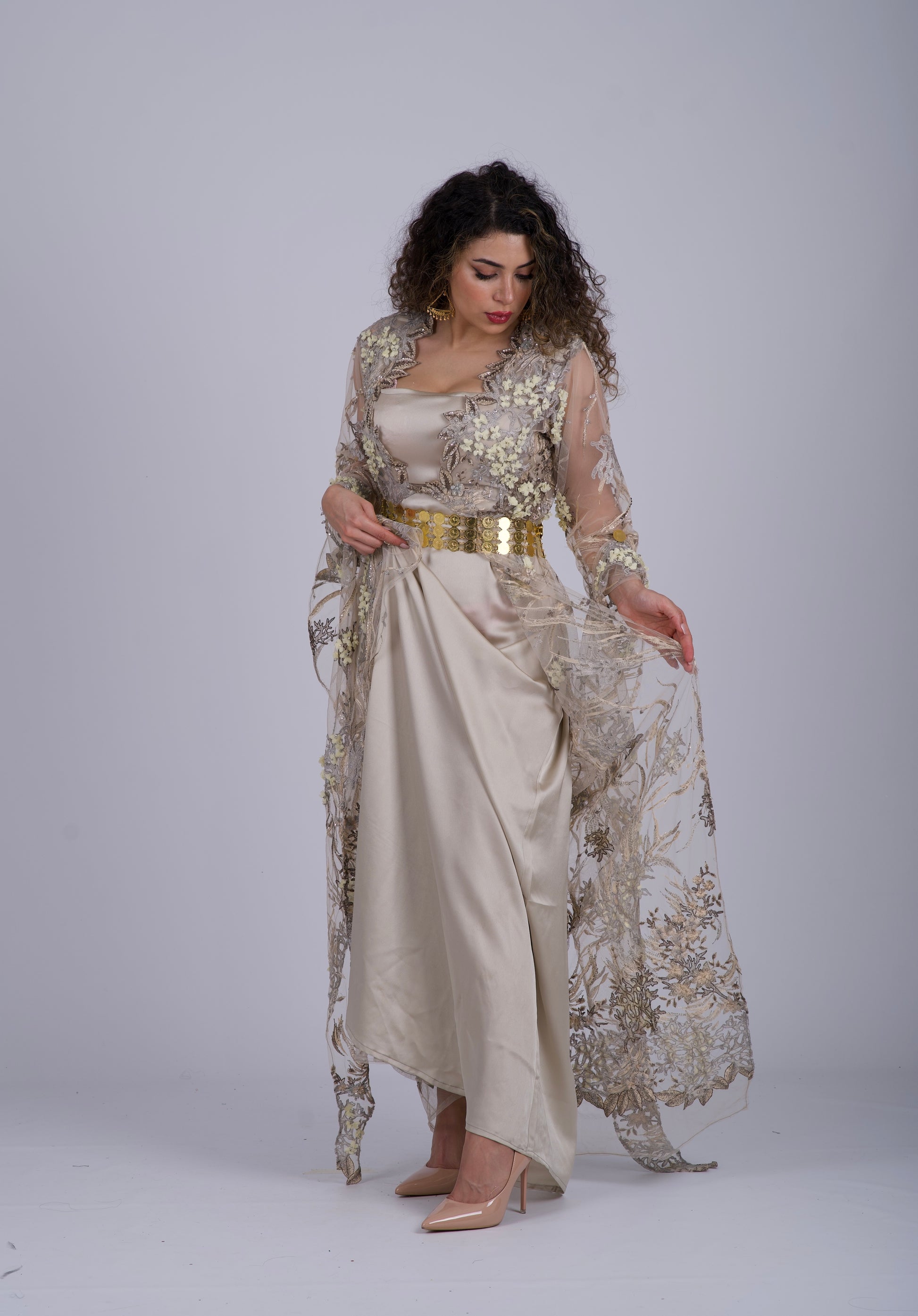 Handmade Kurdish wedding dress adorned with crystal beads and sequins, featuring traditional long Kurdish sleeves and a flexible waist for a perfect fit.

