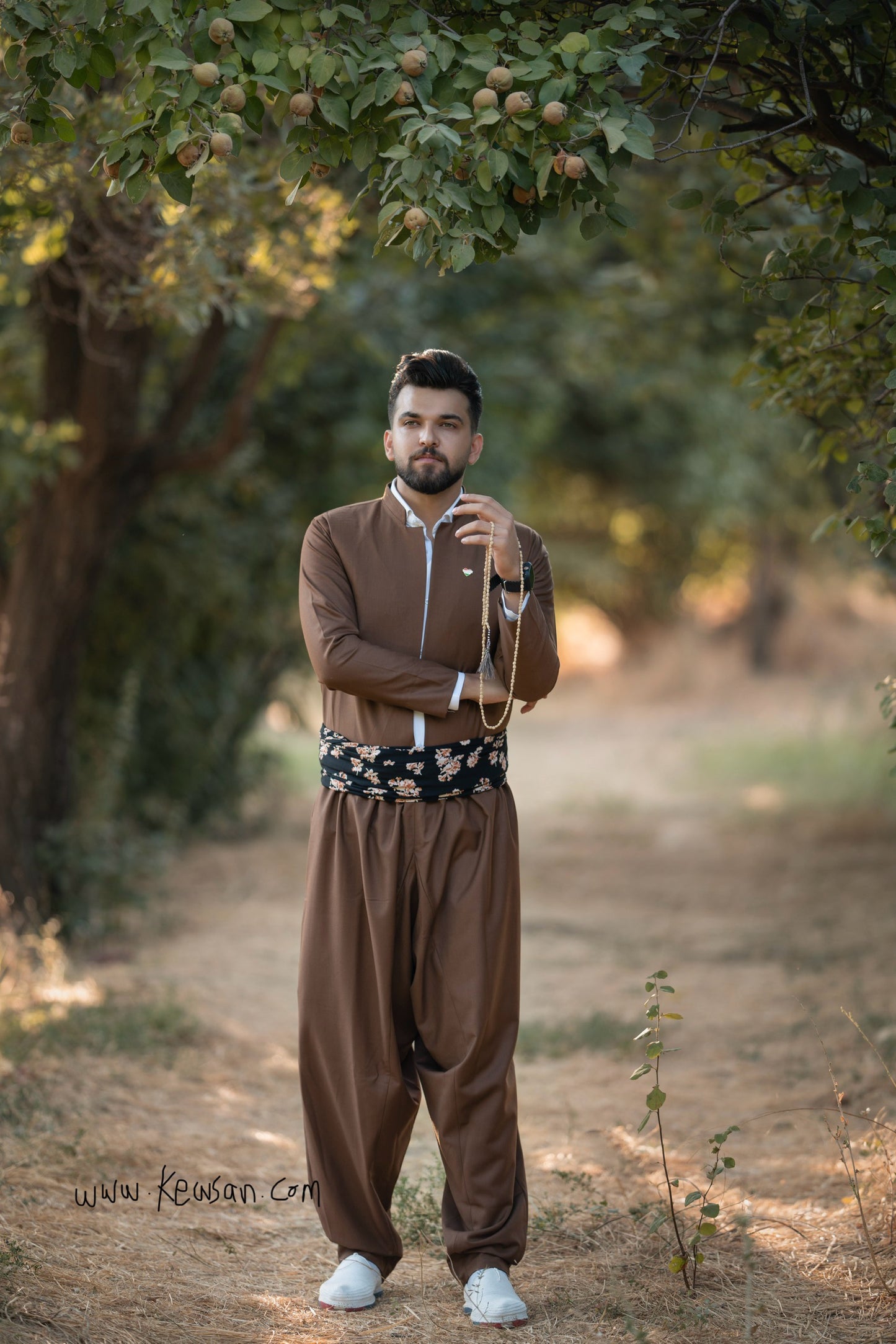 Traditional Kurdish Men's Camel Brown Outfit Set, including Kawa coat, Pantol pants, and Peshtwen Shal belt, ideal for Newroz and weddings.