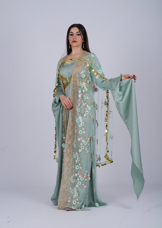 A 4-piece traditional Kurdish dress in mint green, featuring satin silk fabric and intricate embroidery.