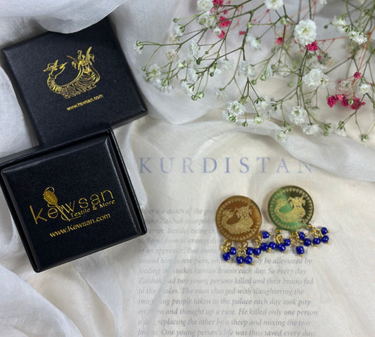 Alt Text: Complete Shamaran Brooch Set in Royal Blue, featuring two arm pins with Lira coin accents and a decorative heart-shaped box.