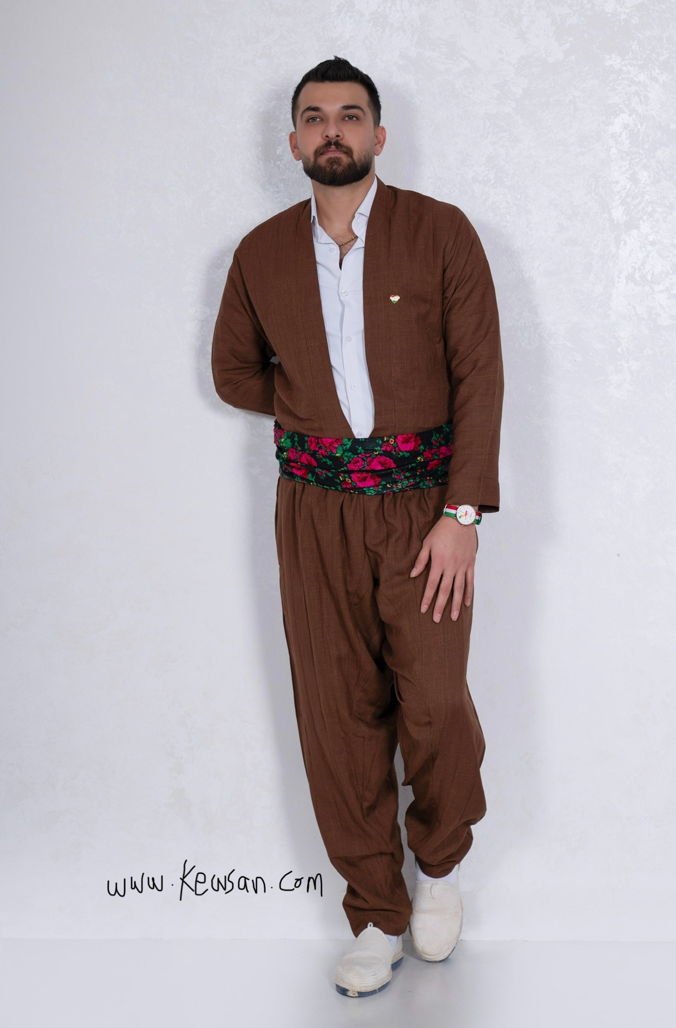 Model wearing the Hawraman Collection in Brown, an ideal Kurdish outfit for Newroz, weddings, and cultural events.