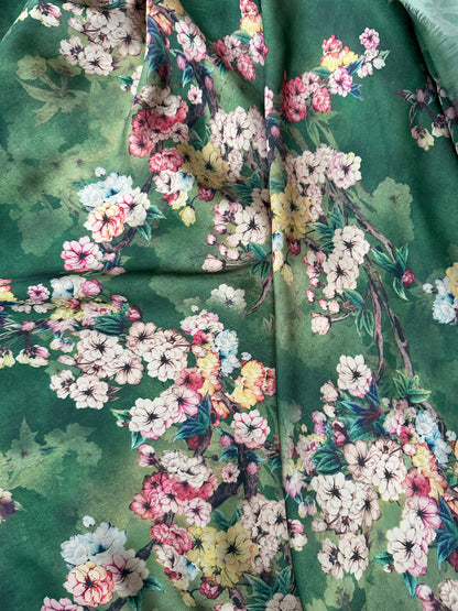 High-quality green floral satin fabric for creating elegant blouses and stunning event dresses