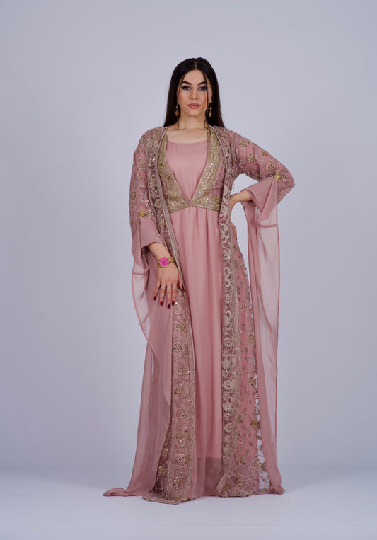 Elegant Kurdish dress in matte pink with a long embroidered coat, adorned with crystals and golden floral details.