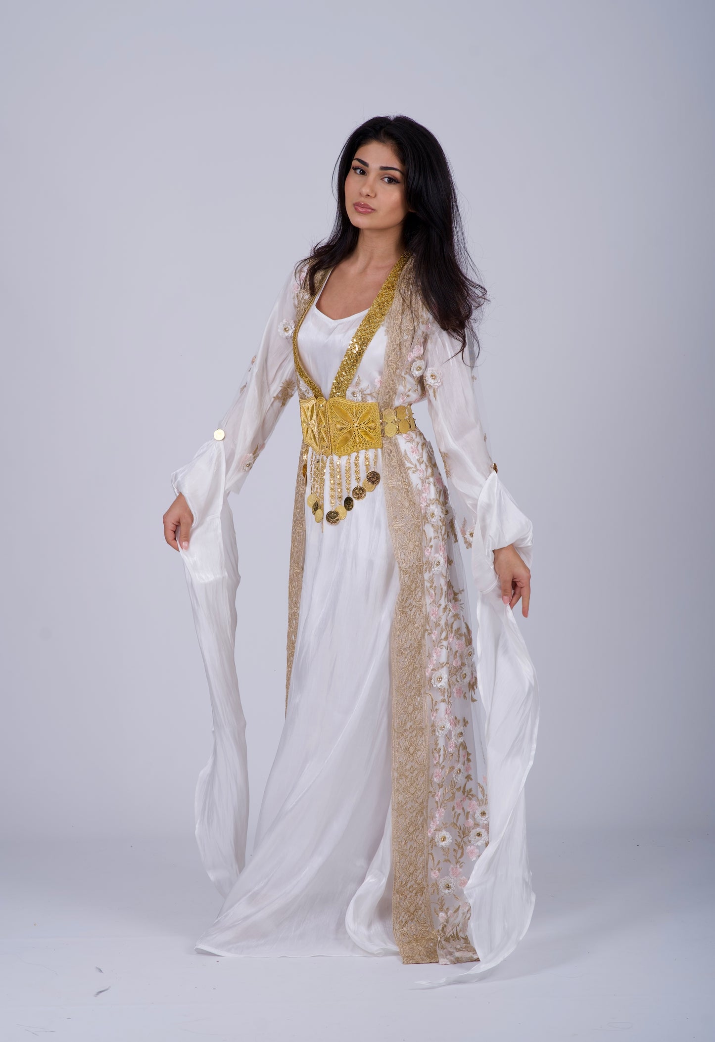 Elegant Kurdish white wedding bride dress with 3D floral embroidery, crystal details, a flowing veil, and a complete traditional bridal set. Perfect for weddings, engagements, and Nikah ceremonies.