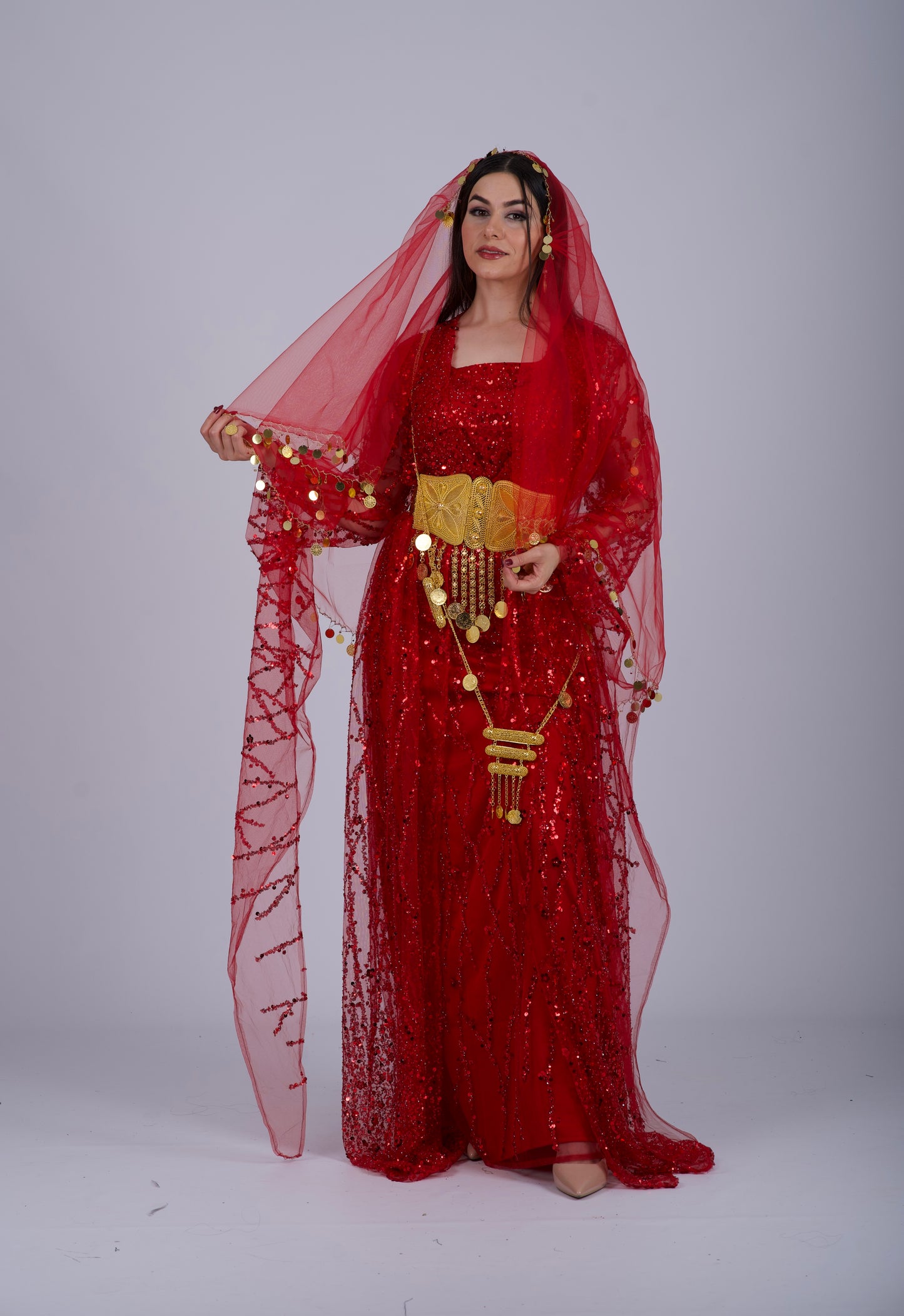 ont view of an elegant red Kurdish dress with crystal embroidery and flowing sleeves, perfect for Henna nights and weddings.