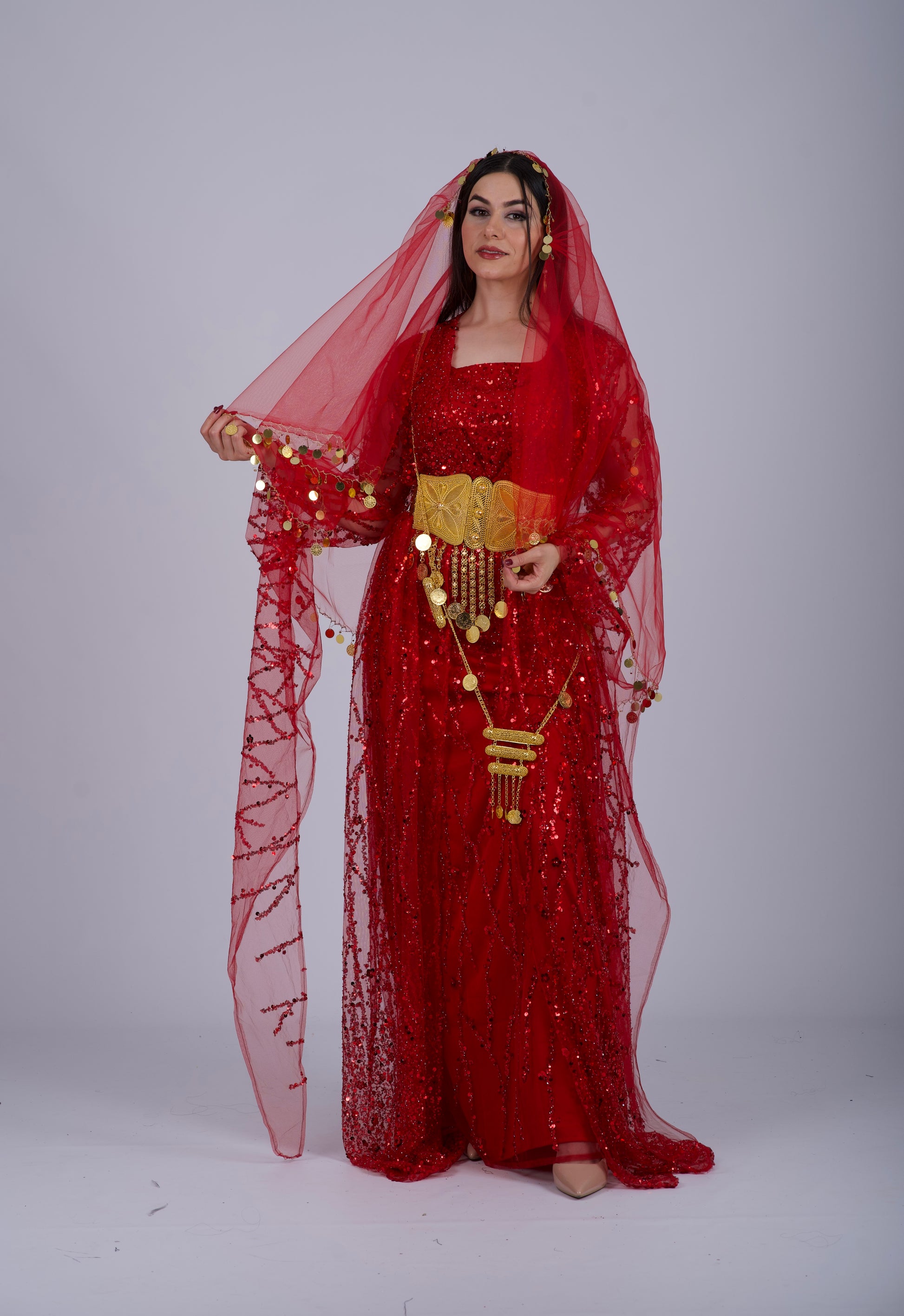 ont view of an elegant red Kurdish dress with crystal embroidery and flowing sleeves, perfect for Henna nights and weddings.