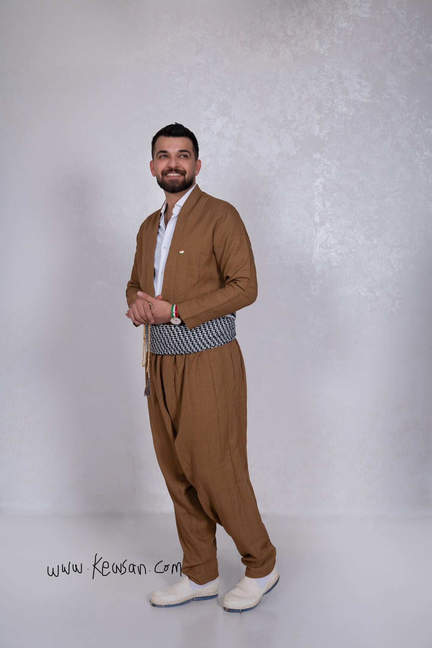  Model wearing the Hawraman Collection in Light Brown, an ideal Kurdish outfit for Newroz, weddings, and cultural events.